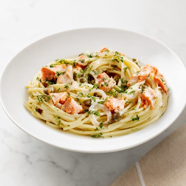 Salmon with Caper Wine Sauce Over Pasta.
